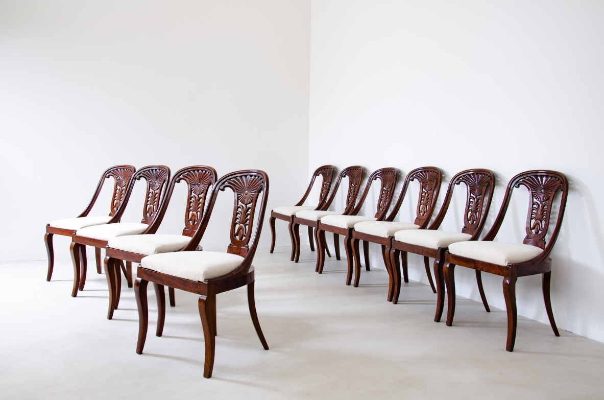 Rare set of 12 antique walnut cockpit chairs in walnut with carved back.  Charles X period,  Northern Italy, around 1830s.