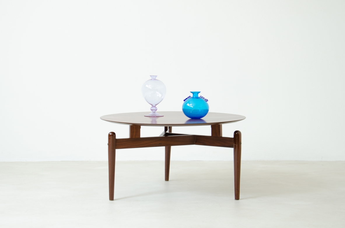 Teak coffee table with three legs held by a structure with crossed spokes and suspended top.  1960's Italian manufacture.