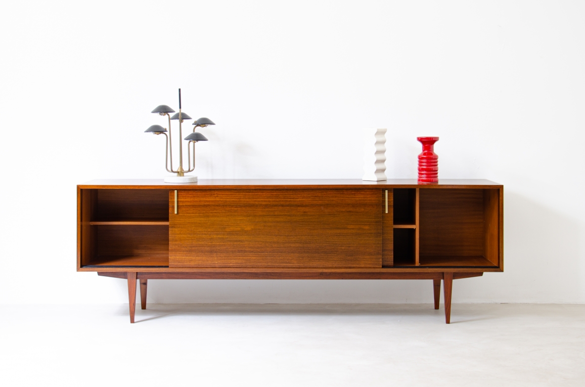 Modernist sideboard in teak with two sliding doors.  Italian manufacture, 1960s.