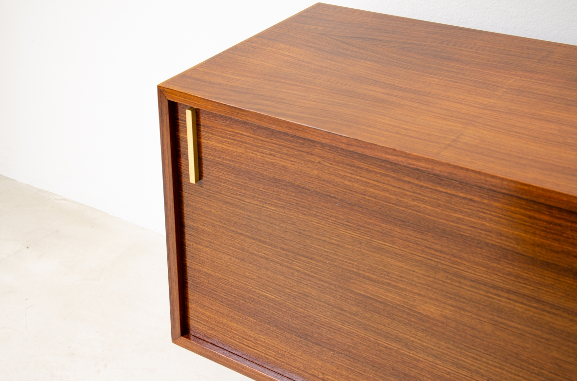 Modernist sideboard in teak with two sliding doors.  Italian manufacture, 1960s.