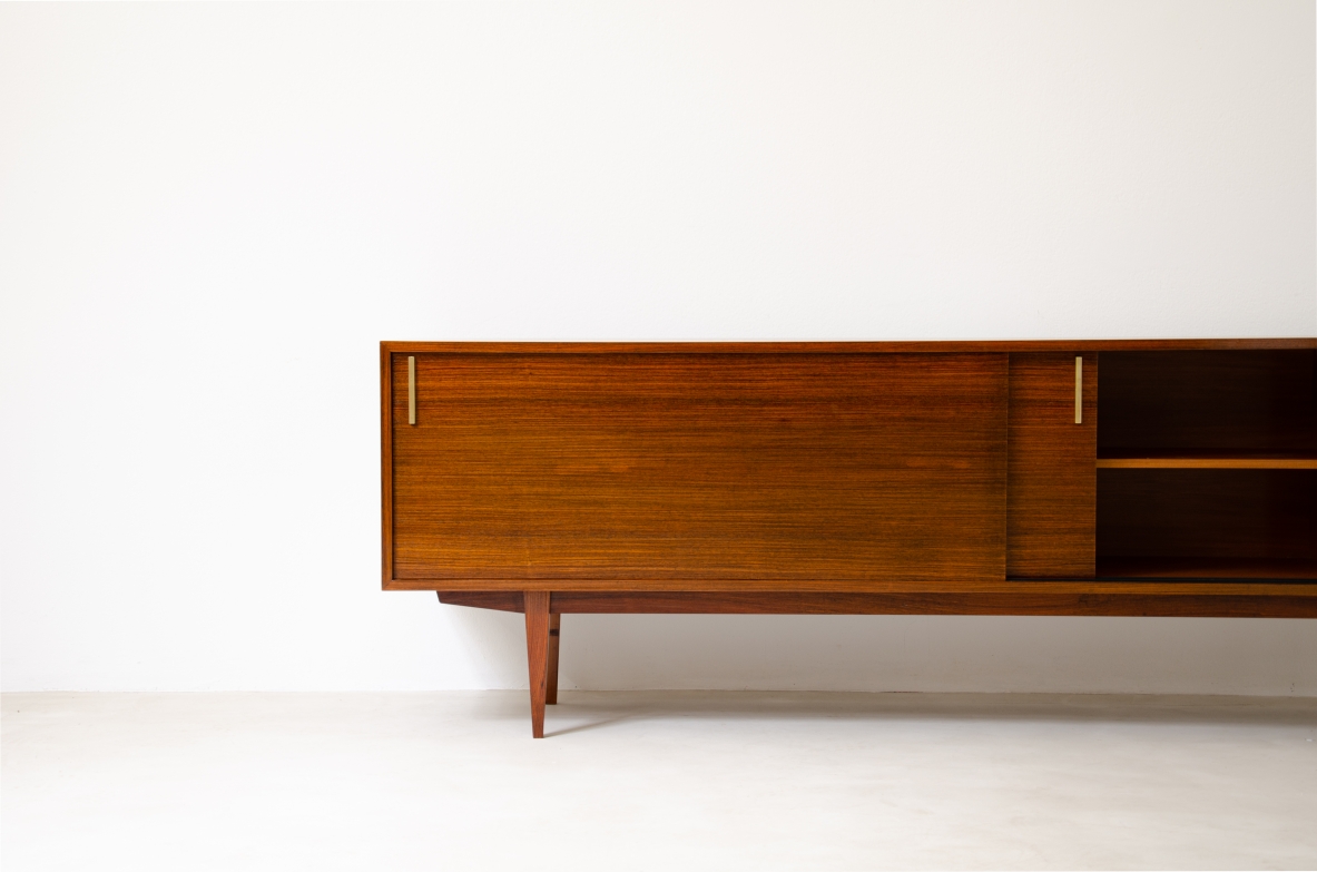 Modernist sideboard in teak with two sliding doors.  Italian manufacture, 1960s.