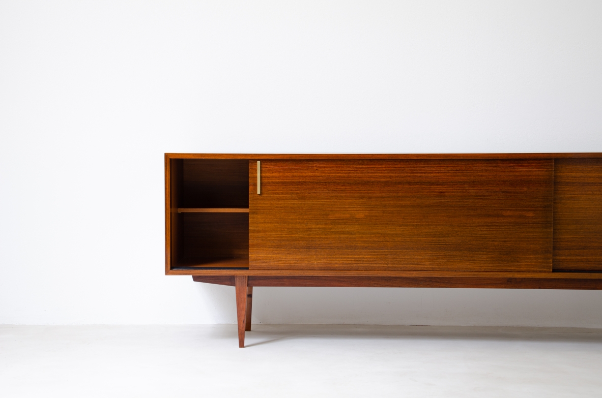 Modernist sideboard in teak with two sliding doors.  Italian manufacture, 1960s.