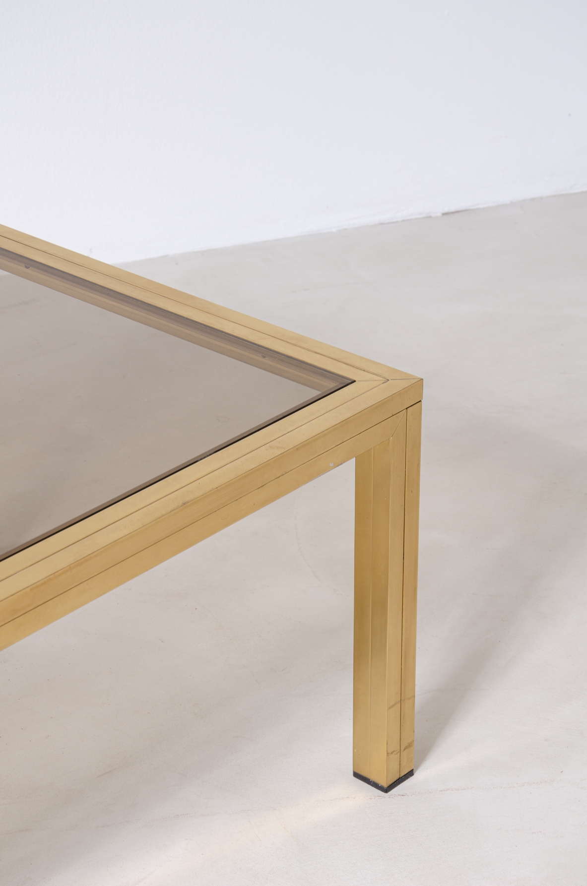 Romeo Rega (1925-1984)  Large Coffee Table in brass with burnished glass top.   Manufacture Rega & Co, Rome, 1970s.