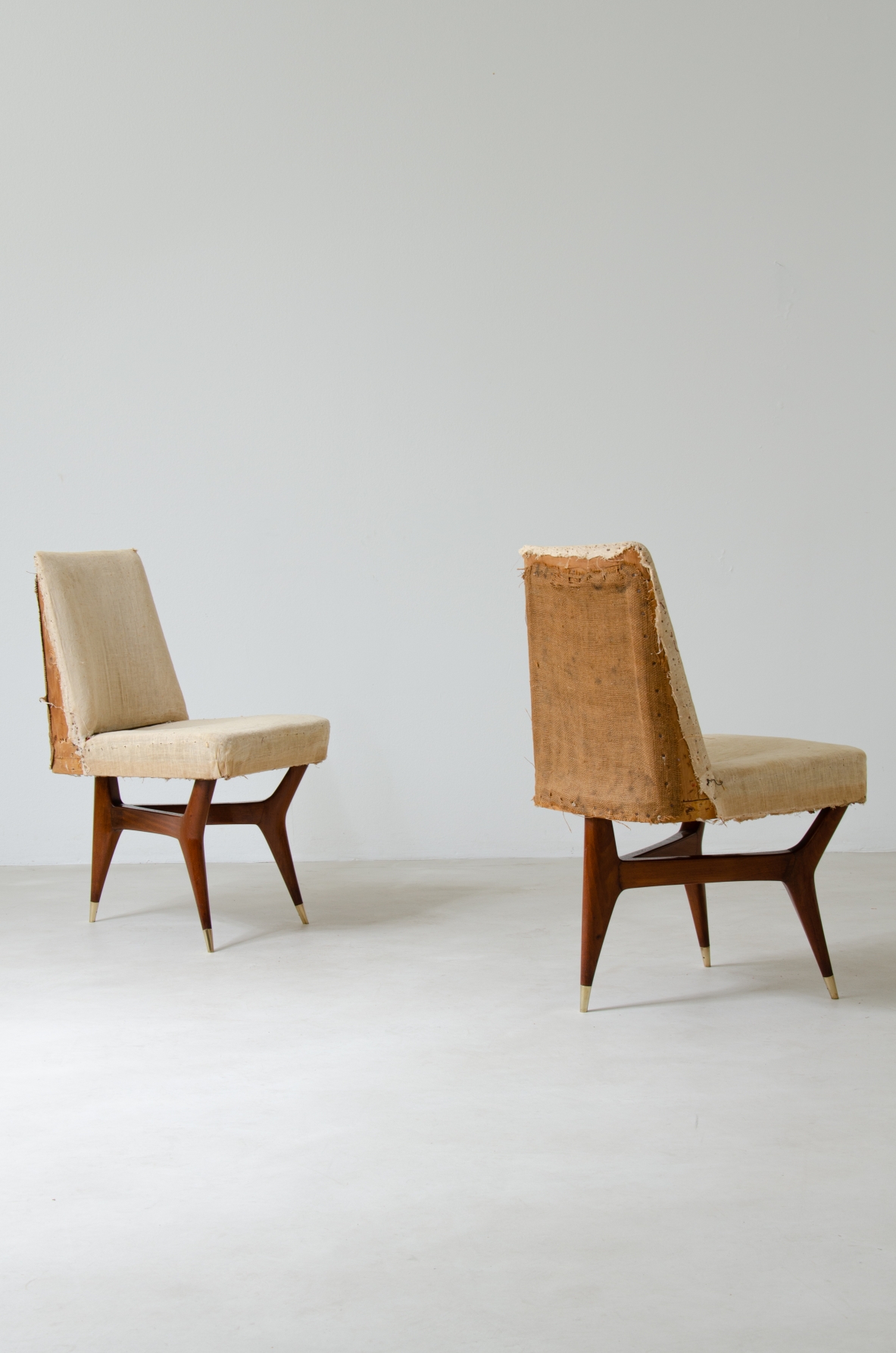 Melchiorre Bega (1898-1976)  Rare set of six wooden chairs with brass tips and fabric upholstery.  Italy, 1956