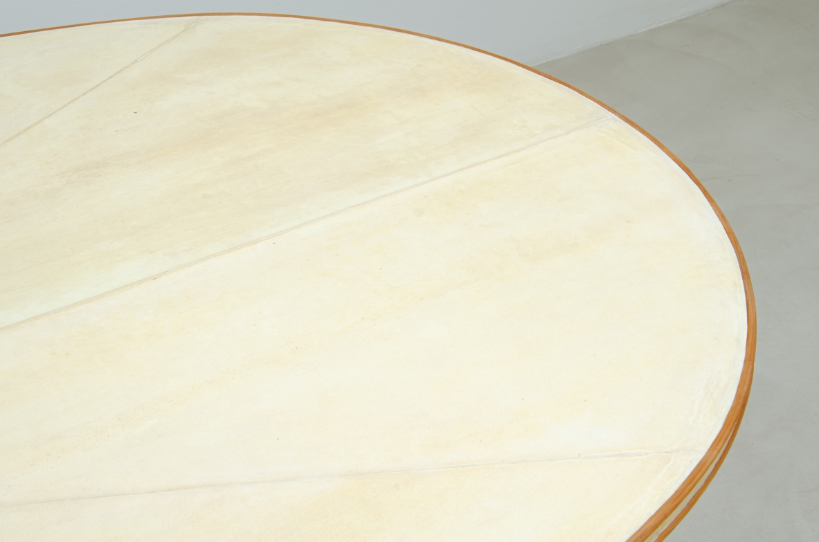 Unique large table with elegant structure in maple wood and top covered with goat skin.  Italian 1950s manufacture.