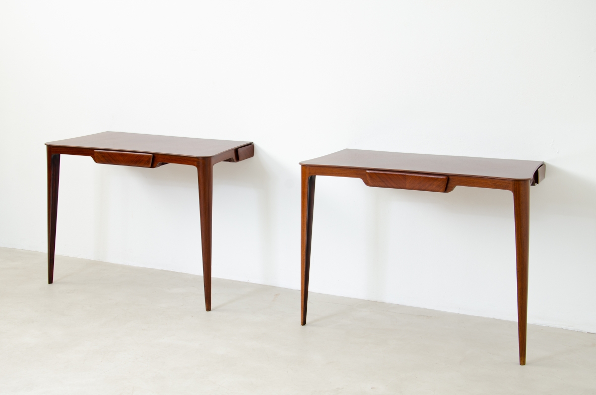 Elegant pair of wooden consoles with exotic wood veneer top and shaped drawer on the front.  Attr. Carlo Rava, 1950s.