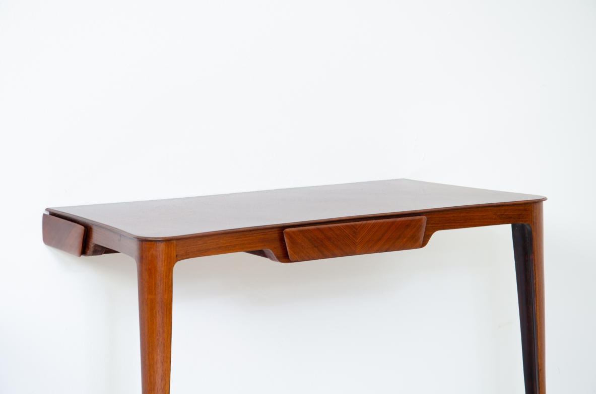 Elegant pair of wooden consoles with exotic wood veneer top and shaped drawer on the front.  Attr. Carlo Rava, 1950s.