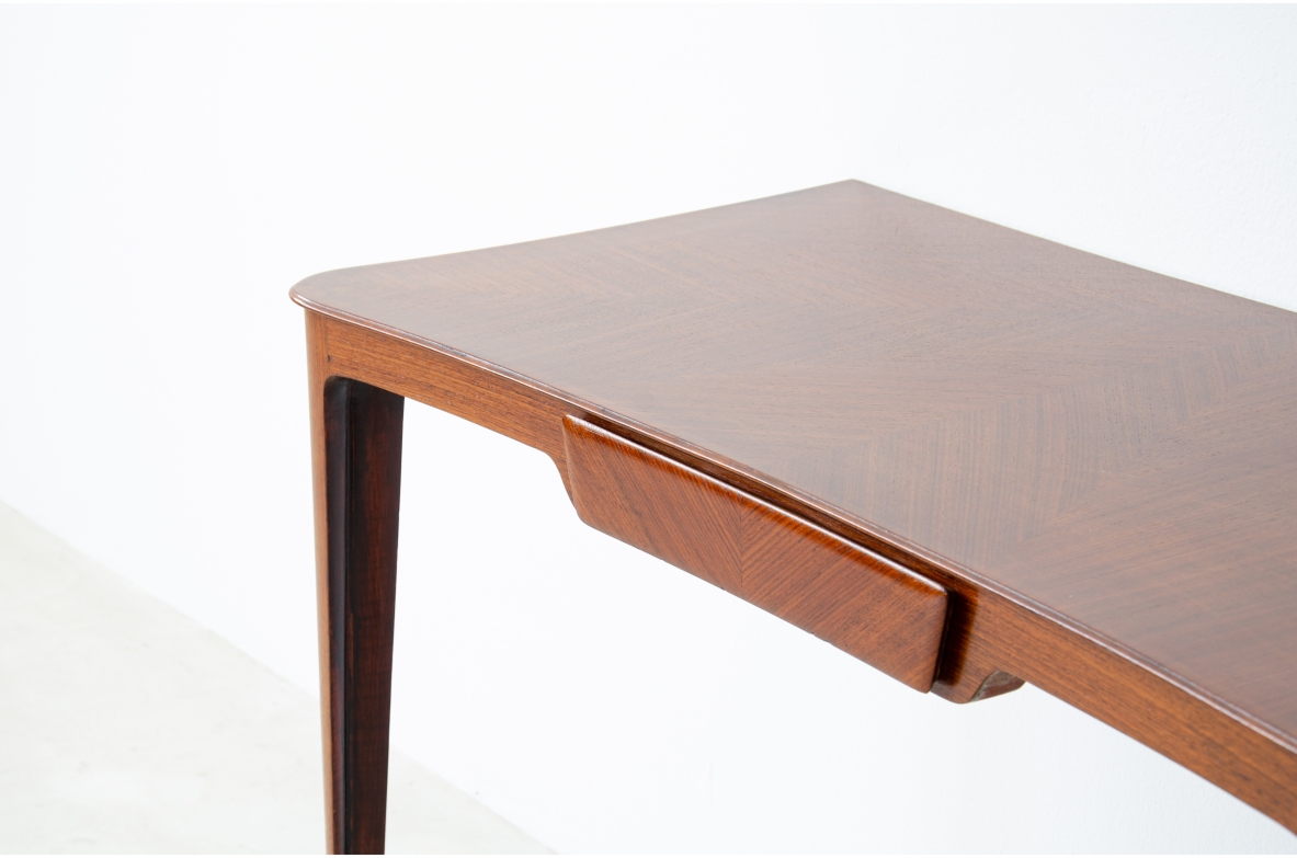 Elegant pair of wooden consoles with exotic wood veneer top and shaped drawer on the front.  Attr. Carlo Rava, 1950s.