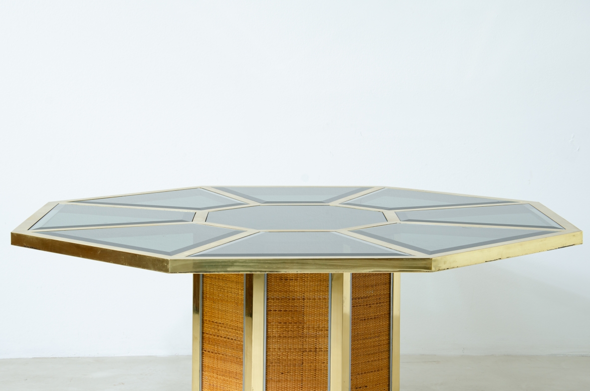 Romeo Rega. Octagonal table in brass, glass and straw. Manufacture Sabot, Italy, 1970's