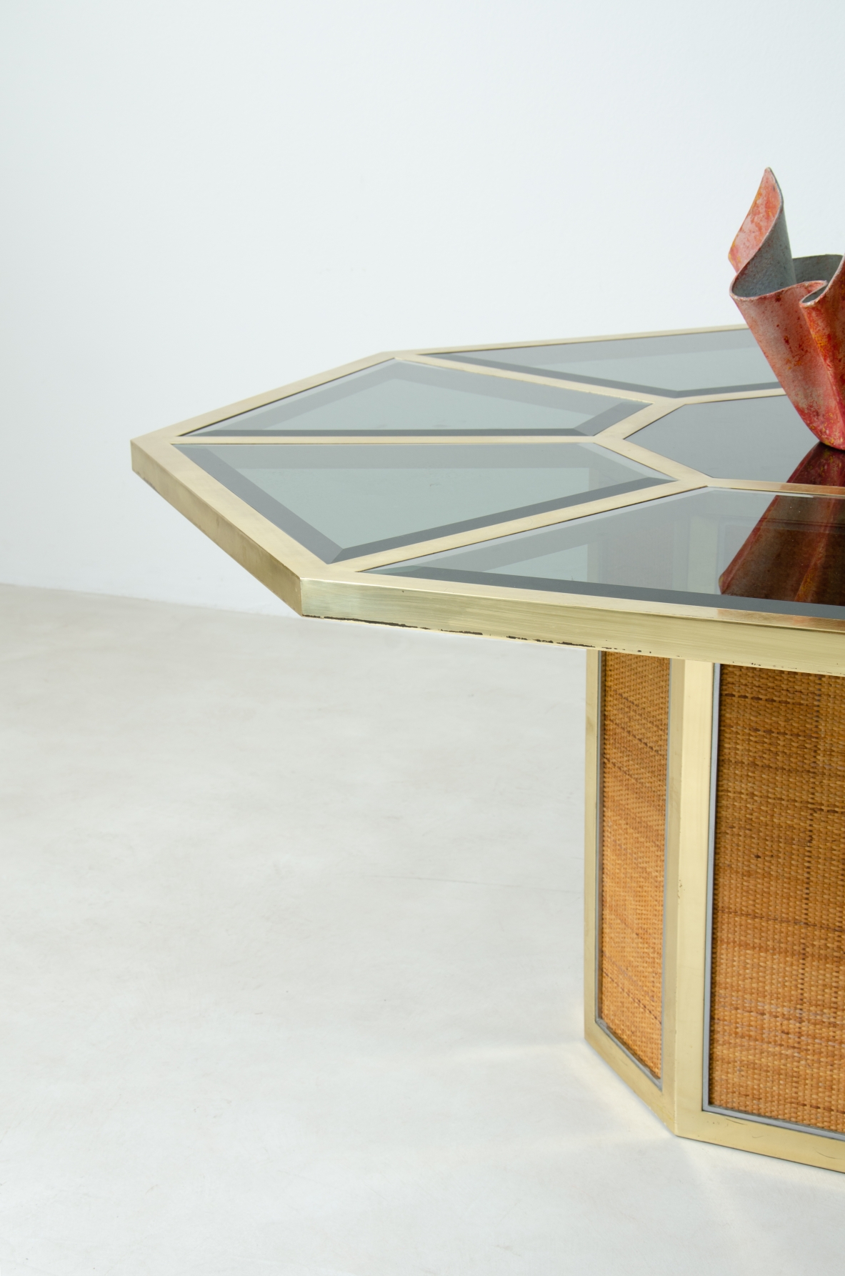 Romeo Rega. Octagonal table in brass, glass and straw. Manufacture Sabot, Italy, 1970's