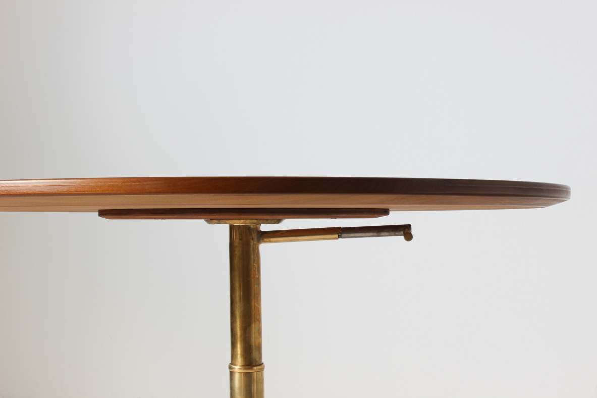 Table with up and down mechanism, brass base and walnut wood top. Italian manufacture, 1950's.