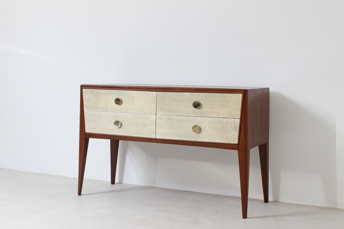 Chest of drawers in walnut with nice long and thin legs and brass handles.  Attributed to Paolo Buffa, 1950's.