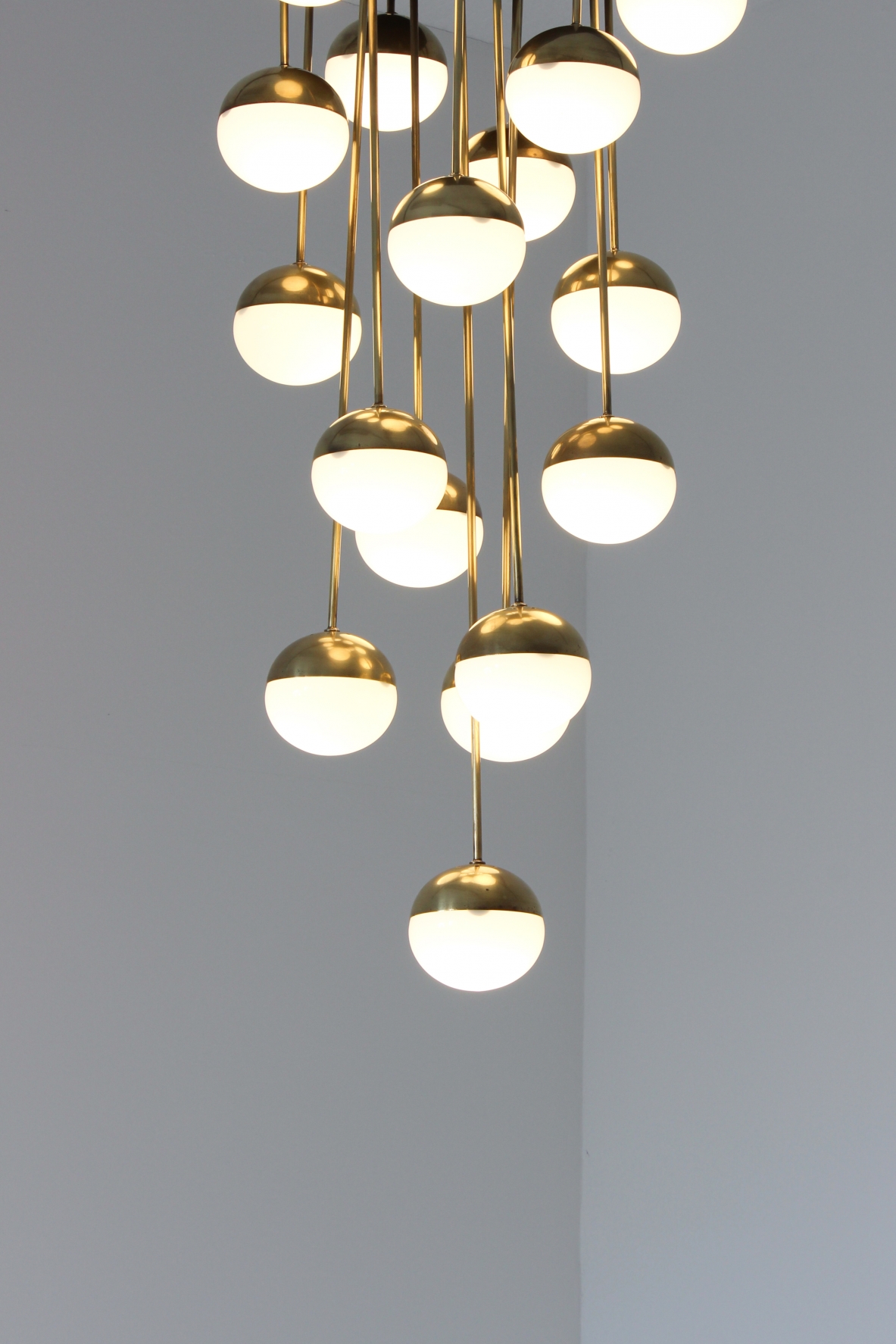 Large 18-light chandelier with brass structure and opaline glasses. Stilnovo production, 1960's.