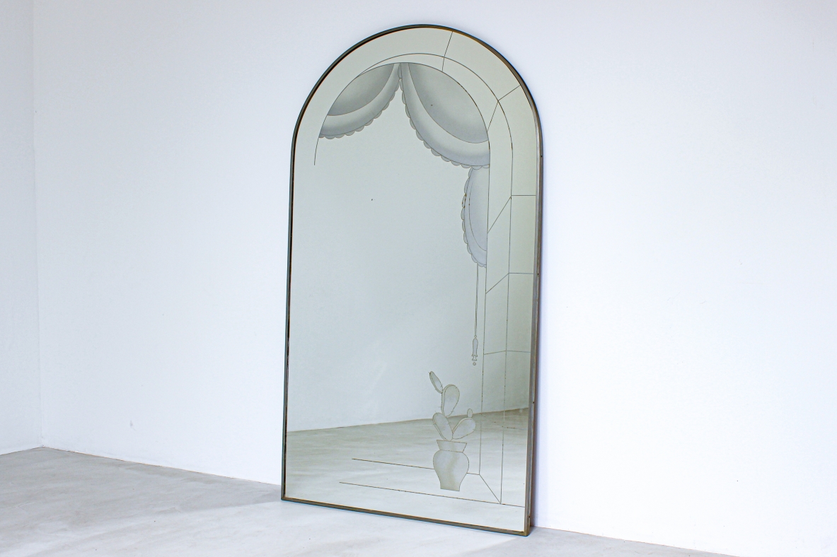 Large arched mirror with architectural design. Italian manufacture around 1940.