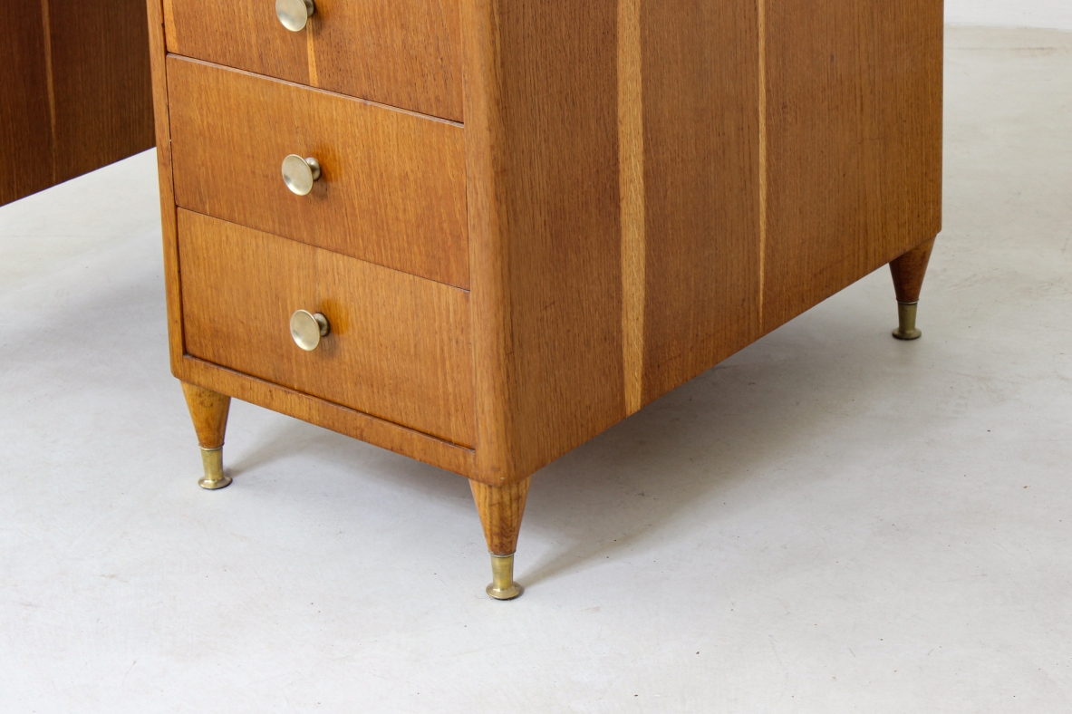 Writing table in oak wood with drawers on both sides, brass tips and crystal glass top.  Italian manufacture 1950's.