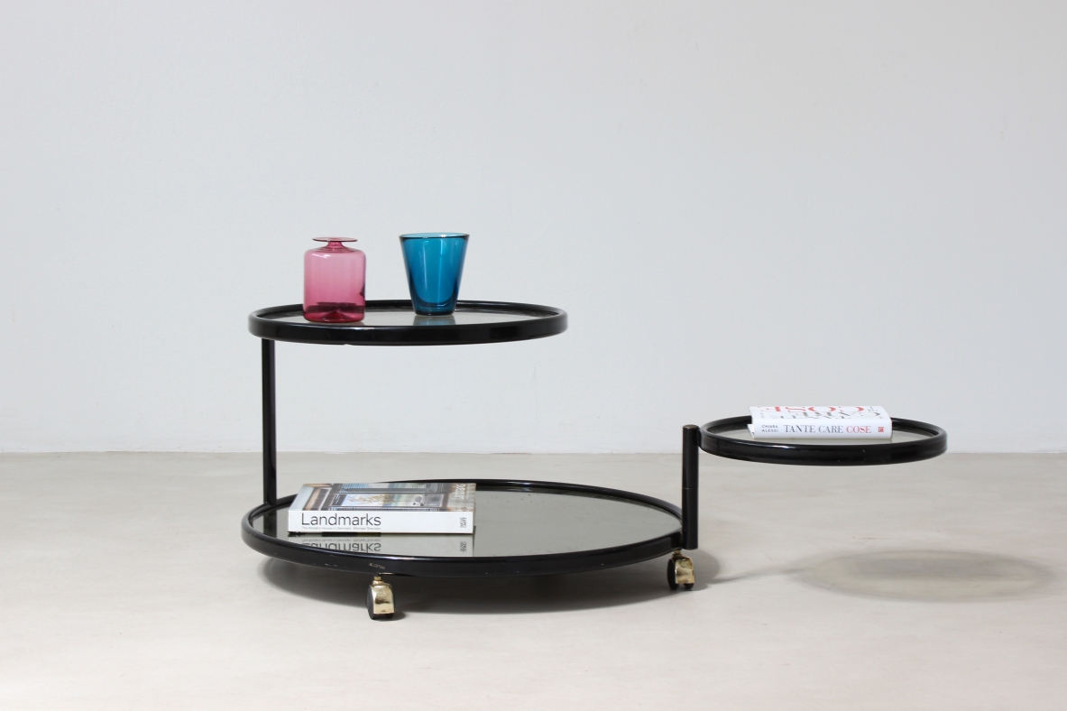 Coffee table in lacquered metal with mirrored top and jointed glass shelves.  Italian manufacture,1970's.