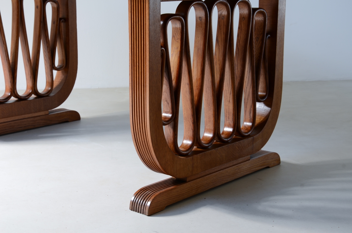 Extraordinary oak table with grissinate uprights and ribbon motif in the style of the period, top with shaped thickness.  Italian manifacture, 1940's