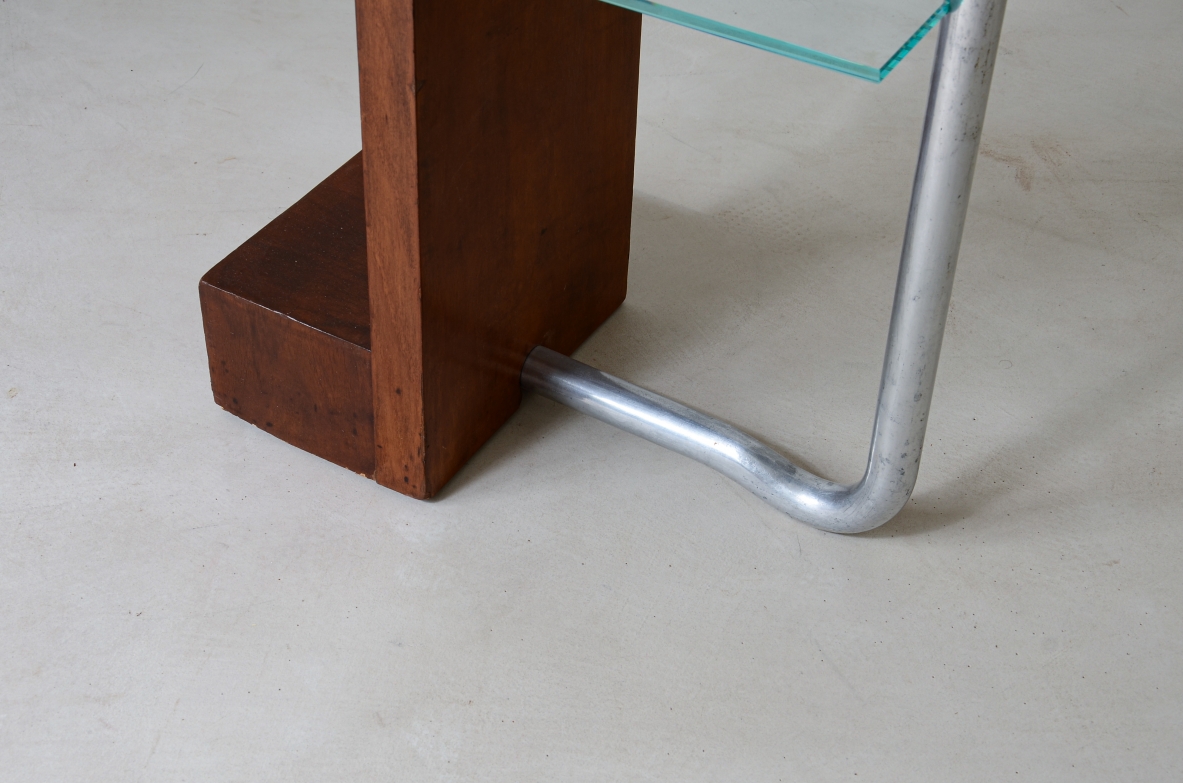 Armando Melis de Villa  Side table in polished wood with curved metal leg.  Designed for the Royal insurance company of Turin.  Italian manufacture, 1930's.