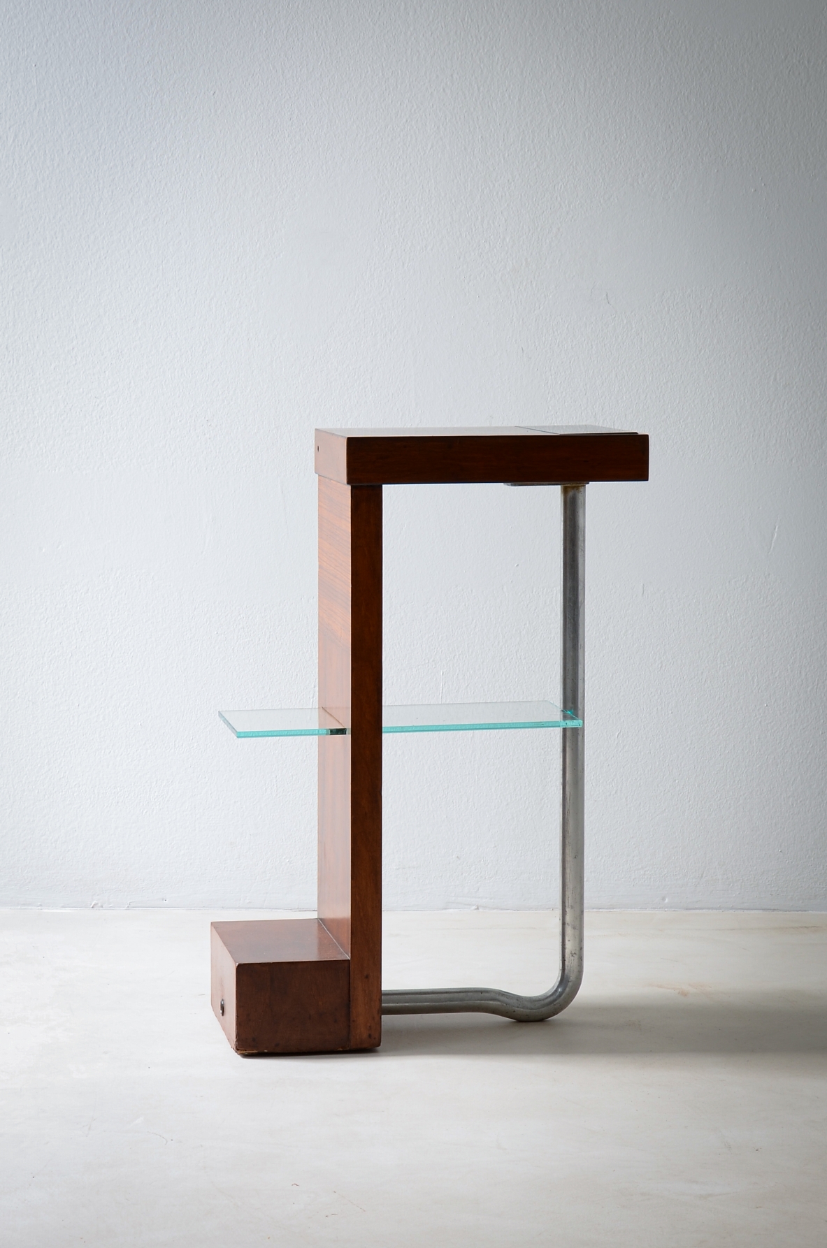 Armando Melis de Villa  Side table in polished wood with curved metal leg.  Designed for the Royal insurance company of Turin.  Italian manufacture, 1930's.