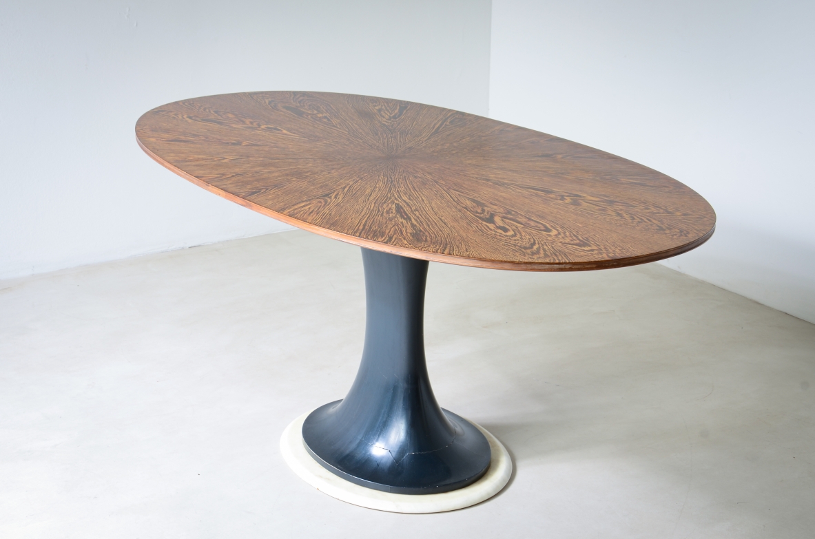 Elegant oval table with turned base in petrol blue lacquered wood and marble disc.  Palm wood veneer top.  Turin School, 1960's.