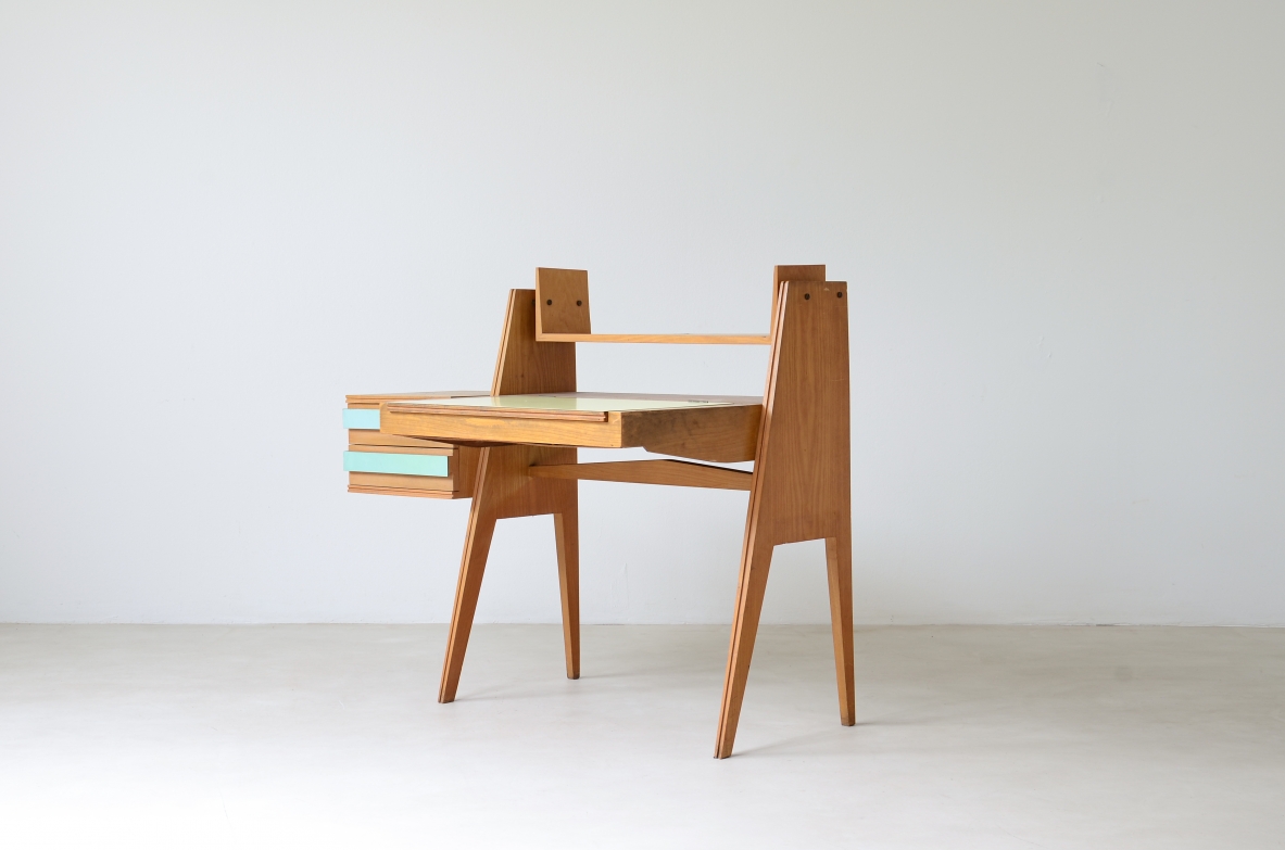 Ico Parisi (1916-1996)  Bedroom writing desk in oak with compartment for objects and shelf. Two drawers on the right side. Top and drawers with original period polypropyleneapplications.