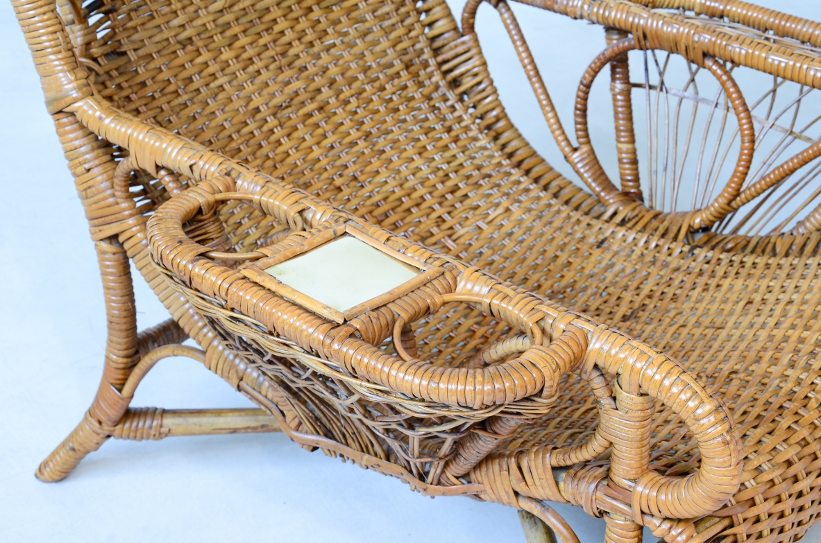 Pair of elegant willow armchairs with weaving on the seat and back as well as composed details, shapes and decorations.  Italian manufacture 1950ca.