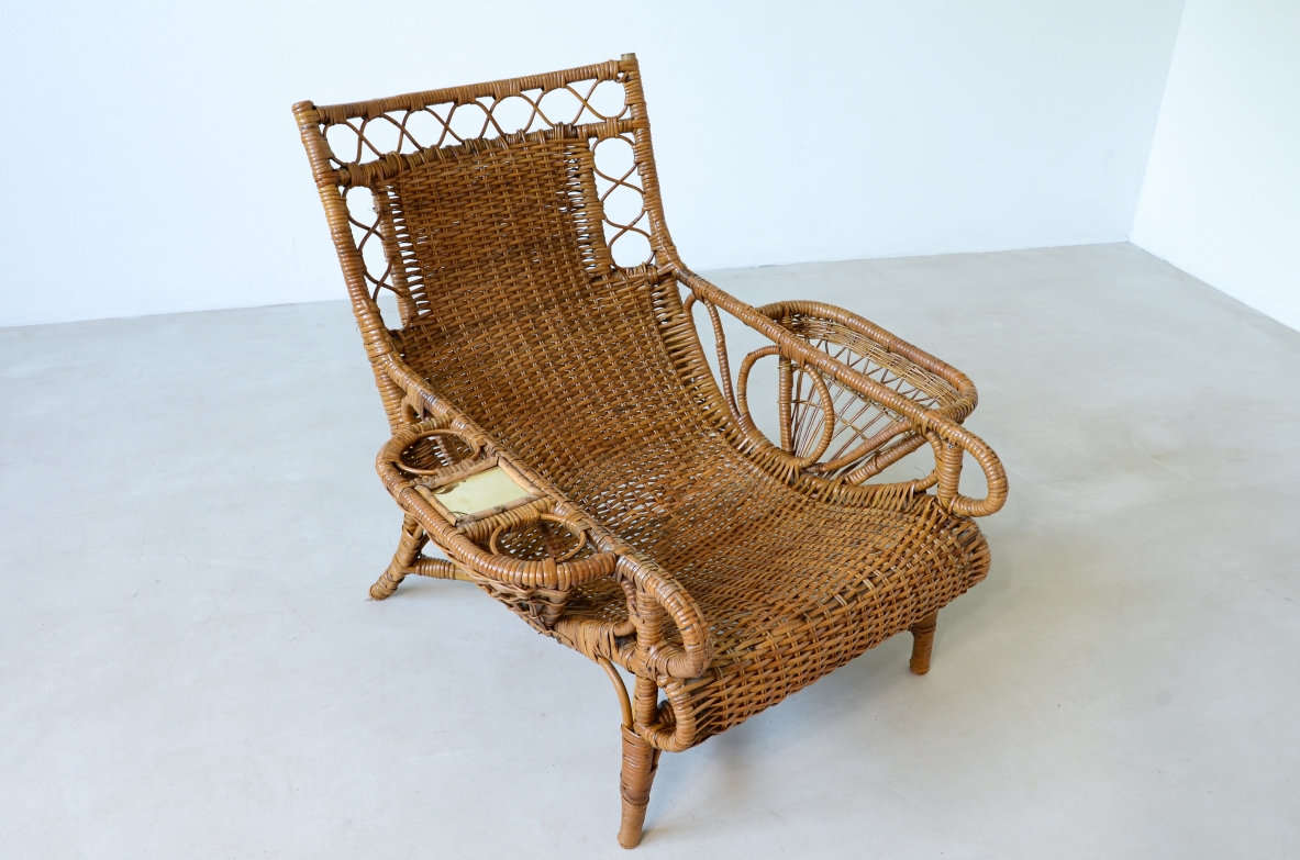 Pair of elegant willow armchairs with weaving on the seat and back as well as composed details, shapes and decorations.  Italian manufacture 1950ca.
