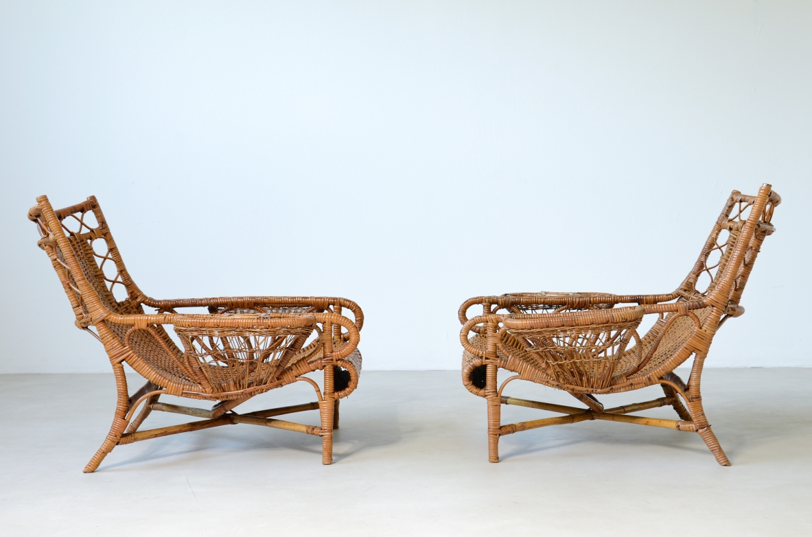 Pair of elegant willow armchairs with weaving on the seat and back as well as composed details, shapes and decorations.  Italian manufacture 1950ca.