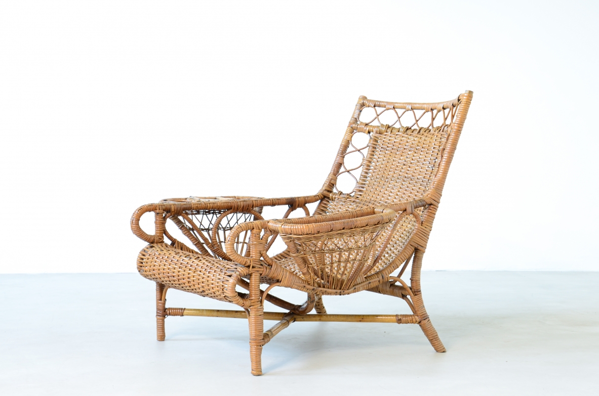 Pair of elegant willow armchairs with weaving on the seat and back as well as composed details, shapes and decorations. Italian manufacture 1950ca.