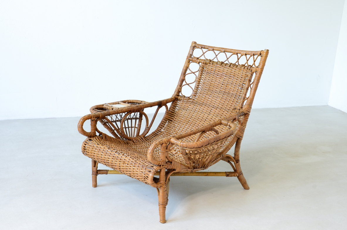 Pair of elegant willow armchairs with weaving on the seat and back as well as composed details, shapes and decorations. Italian manufacture 1950ca.