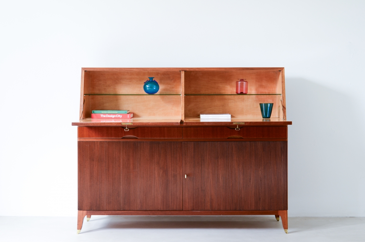 Storage unit with front in grinded wood and two drop-down shelves with interiors in blond maple and a ground glass top.  Two drawers and elegant feet with brass tips.  Italian manufacture, 1940's
