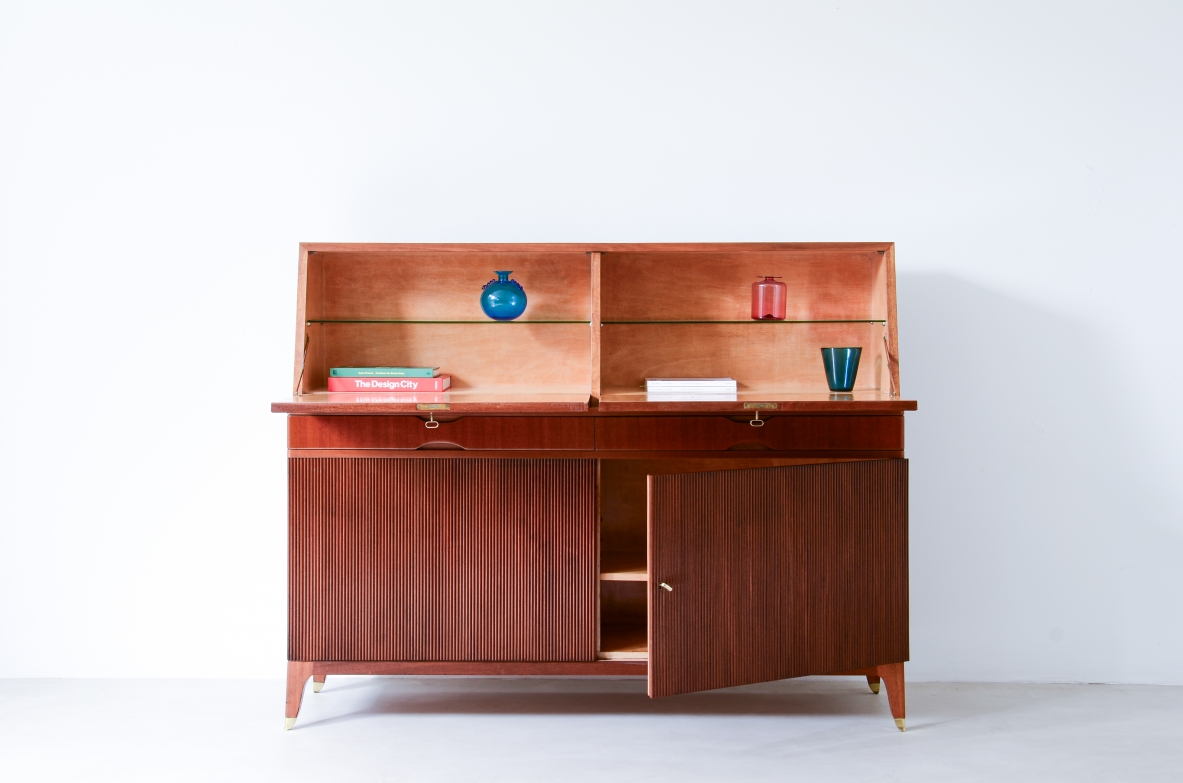 Storage unit with front in grinded wood and two drop-down shelves with interiors in blond maple and a ground glass top.  Two drawers and elegant feet with brass tips.  Italian manufacture, 1940's