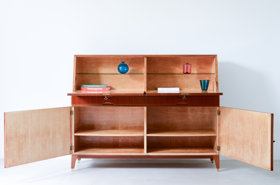 Storage unit with front in grinded wood and two drop-down shelves with interiors in blond maple and a ground glass top.  Two drawers and elegant feet with brass tips.  Italian manufacture, 1940's
