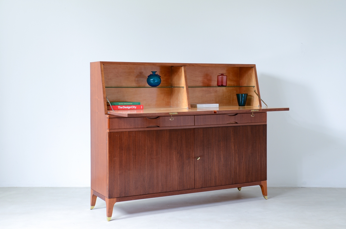 Storage unit with front in grinded wood and two drop-down shelves with interiors in blond maple and a ground glass top.  Two drawers and elegant feet with brass tips.  Italian manufacture, 1940's