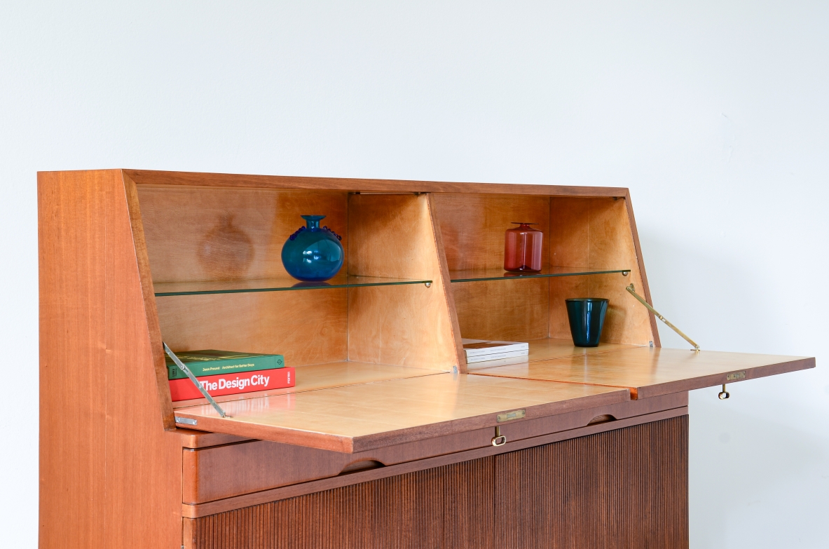 Storage unit with front in grinded wood and two drop-down shelves with interiors in blond maple and a ground glass top.  Two drawers and elegant feet with brass tips.  Italian manufacture, 1940's