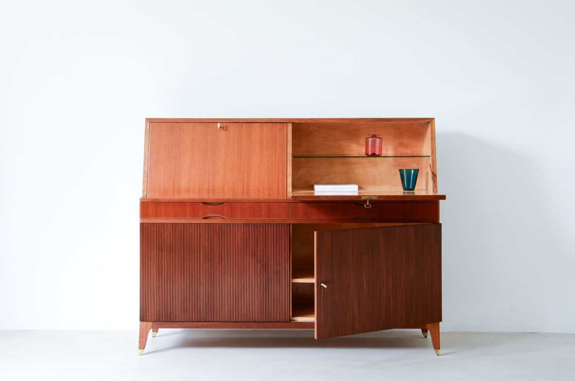 Storage unit with front in grinded wood and two drop-down shelves with interiors in blond maple and a ground glass top.  Two drawers and elegant feet with brass tips.  Italian manufacture, 1940's