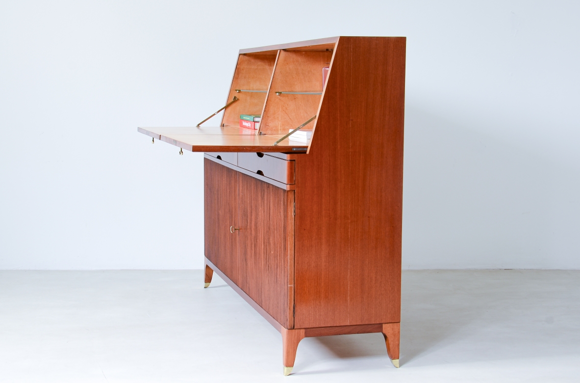 Storage unit with front in grinded wood and two drop-down shelves with interiors in blond maple and a ground glass top.  Two drawers and elegant feet with brass tips.  Italian manufacture, 1940's
