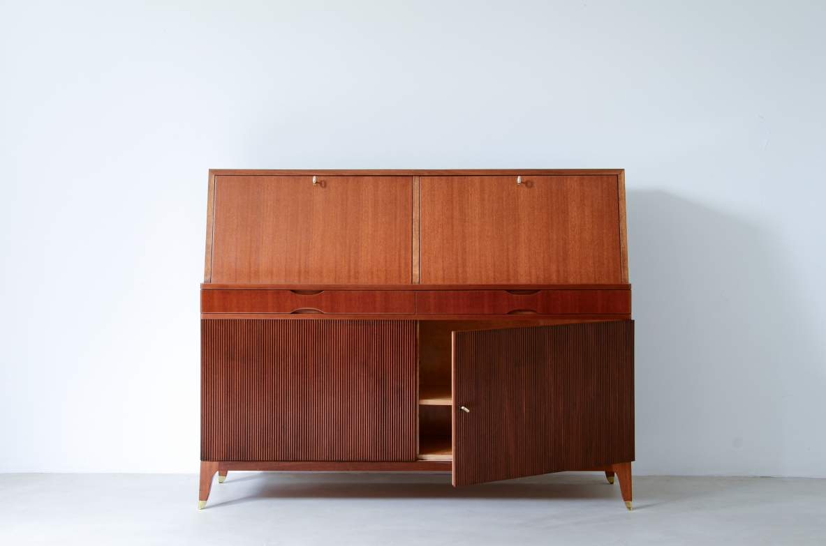 Storage unit with front in grinded wood and two drop-down shelves with interiors in blond maple and a ground glass top.  Two drawers and elegant feet with brass tips.  Italian manufacture, 1940's