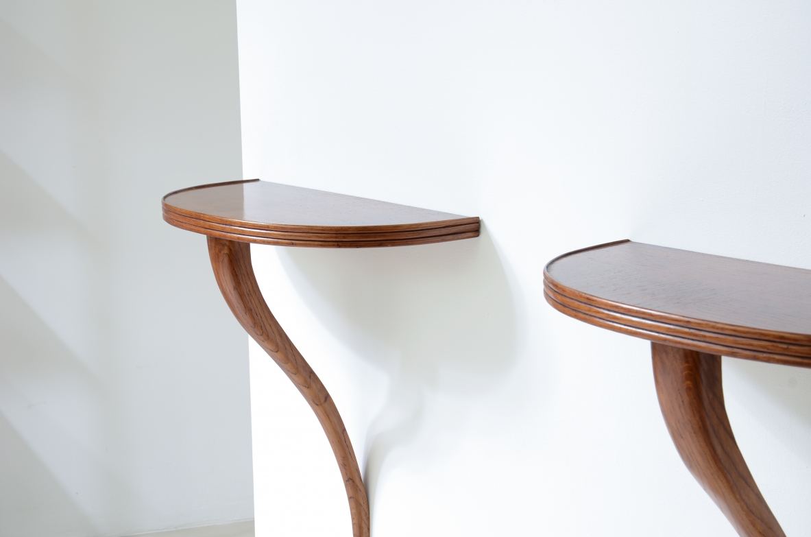 Pair of small consoles in oak with half-moon top and wall support arm.  talian manufacture, around 1940