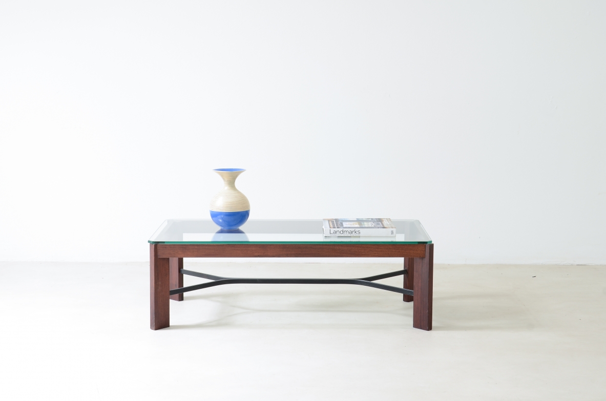 Coffee table with metal cross and thick glass top.  Made in Italy around 1960.