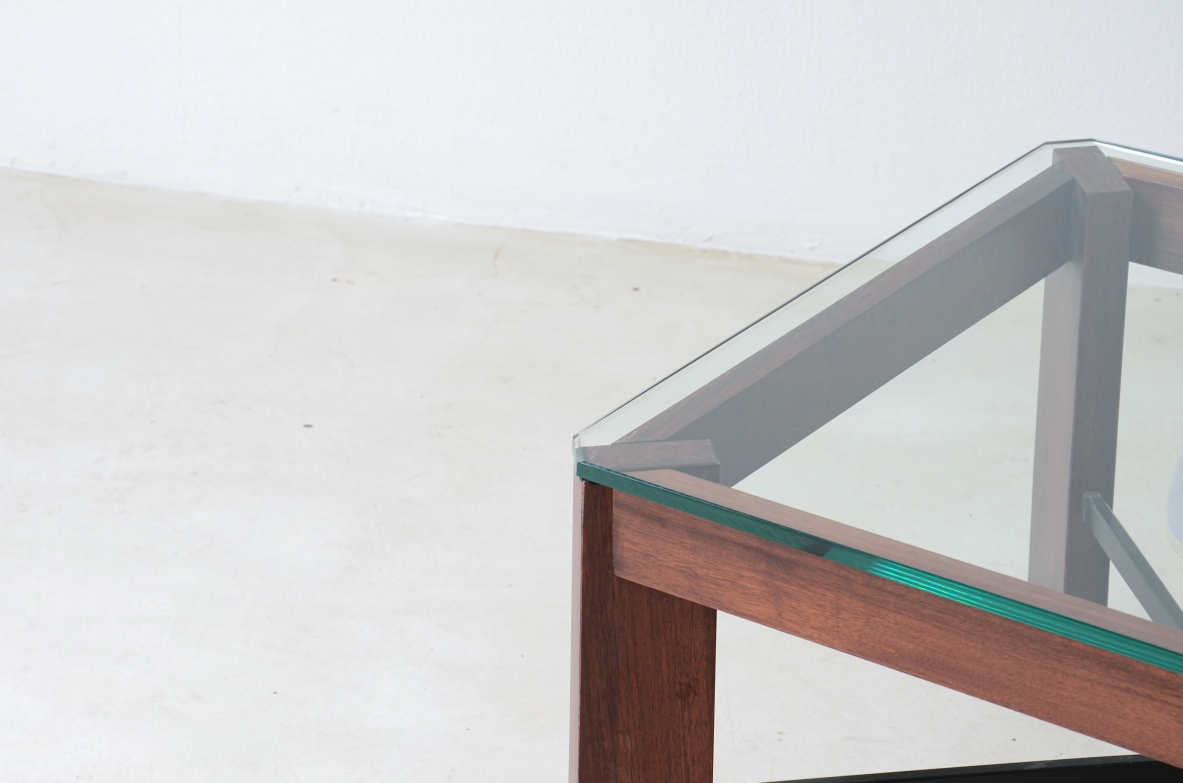 Coffee table with metal cross and thick glass top.  Made in Italy around 1960.