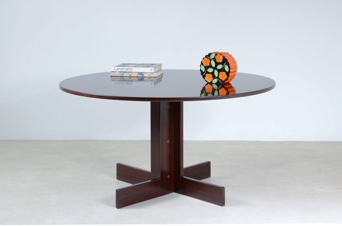 Rosewood table with helix base, brass details.  Italian manufacture, 1970's.
