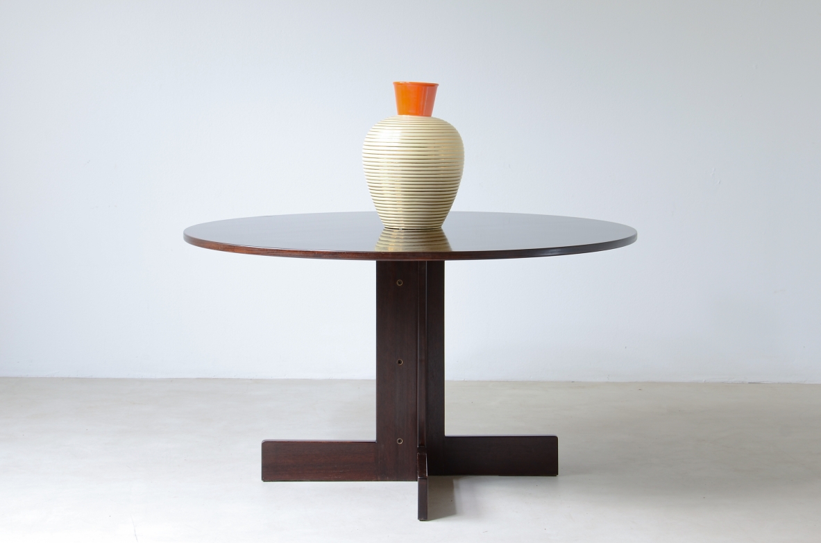 Rosewood table with helix base, brass details.  Italian manufacture, 1970's.