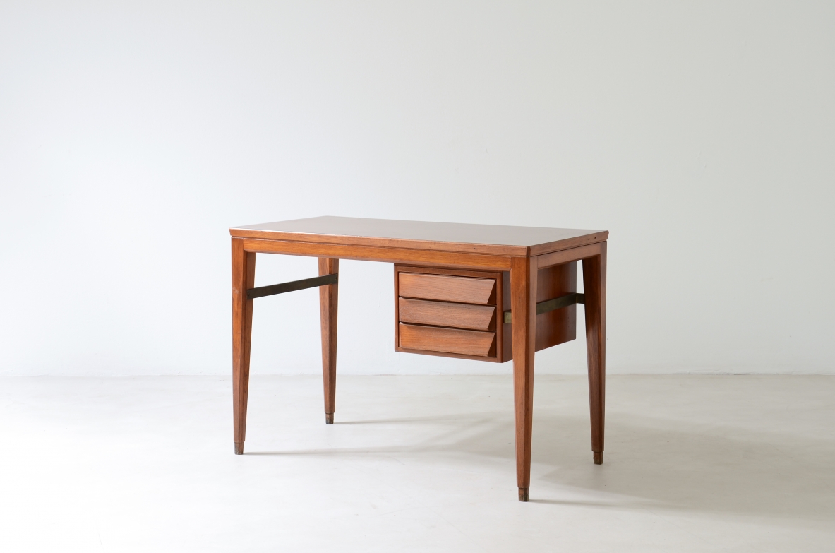 Gio Ponti Elegant oak desk designed by Gio Ponti for the National bank. Slightly curved legs joined by a brass spacer, three drawers with shaped front.