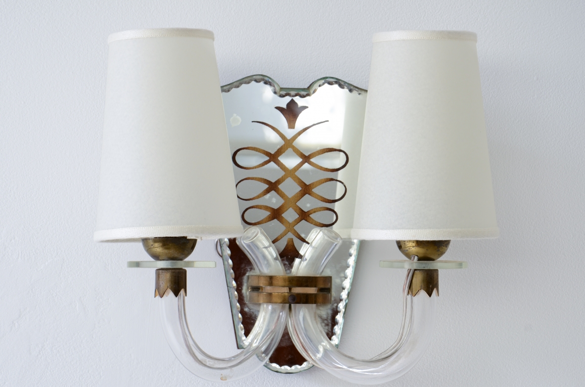 Emilio Lancia  Pair of wall lamps with elegant blown glass arms, shaped fan in engraved and mirrored crystal with brass profile.  1930's manufacture.
