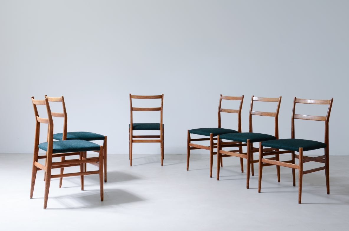 Gio Ponti  Set of 6 chairs in nut wood with fabric covering.  Model leggera