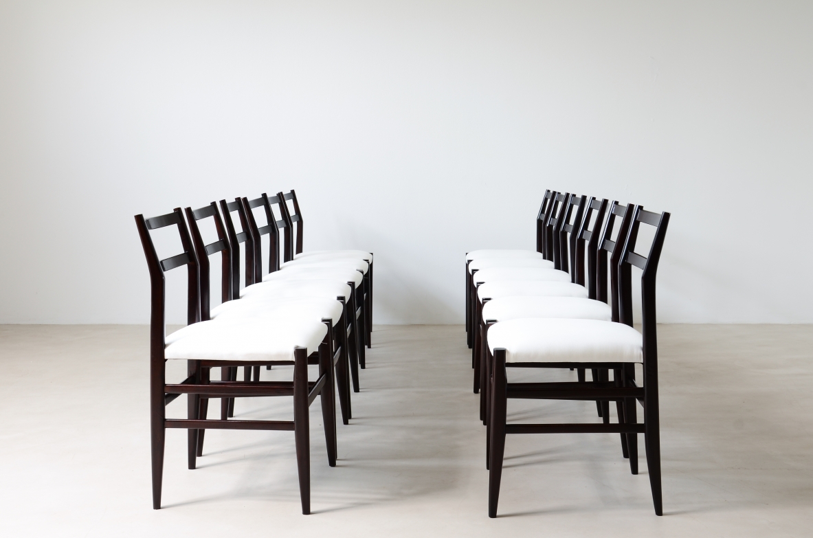 Gio Ponti  Set of 12 chairs in black stained wood with fabric covering.  Modello leggera,  Cassina manufacture 1954.