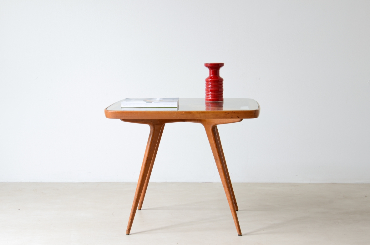 Table with visible cross on the top and legs and elegant thin legs.  Italian manufacture from the 1950s