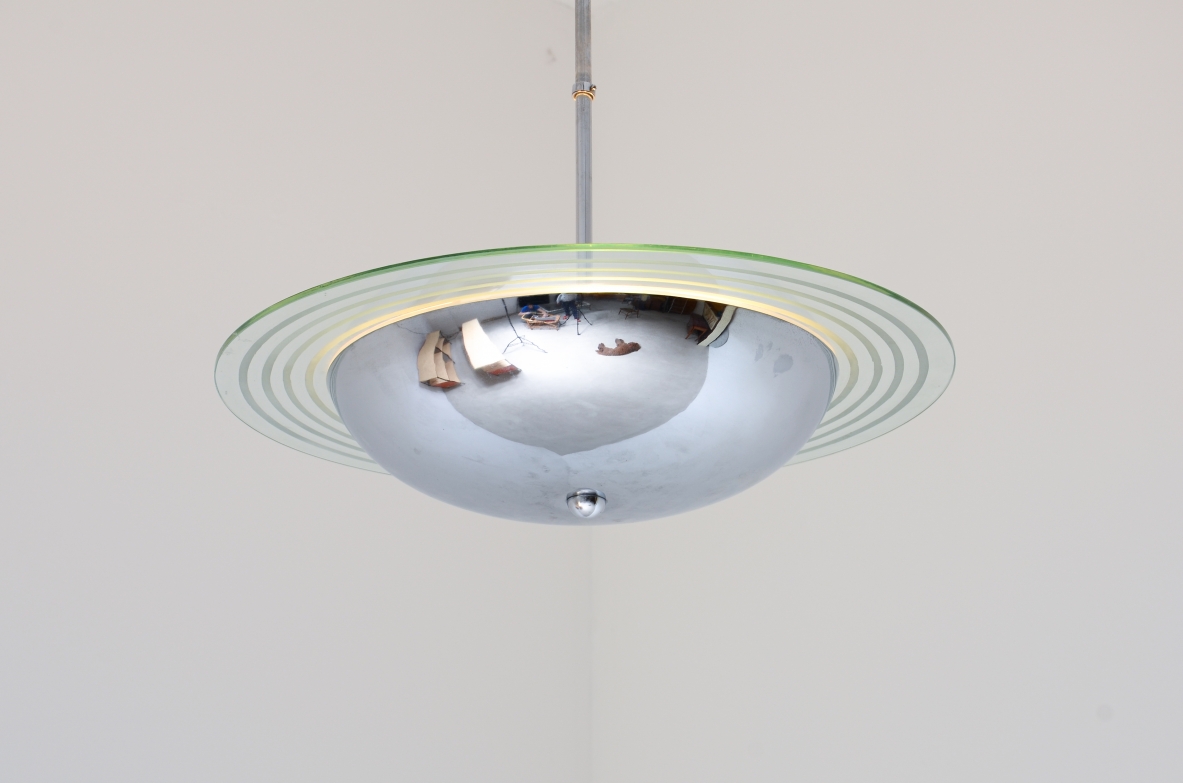 Chromed metal chandelier with cut and engraved crystal disc.  Italian manufacture ca. 1960.