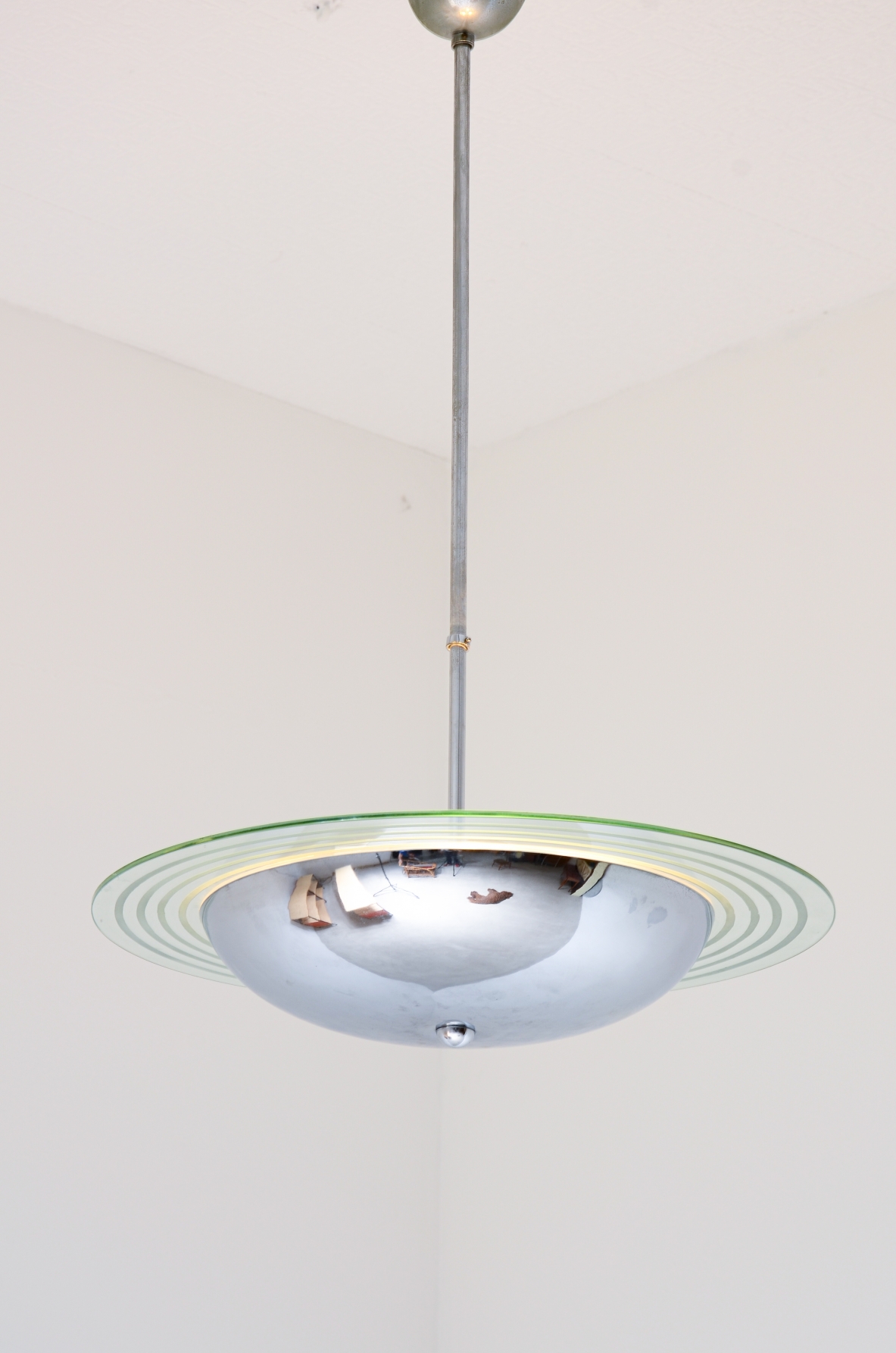 Chromed metal chandelier with cut and engraved crystal disc.  Italian manufacture ca. 1960.
